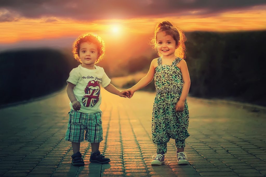 siblings holding hands