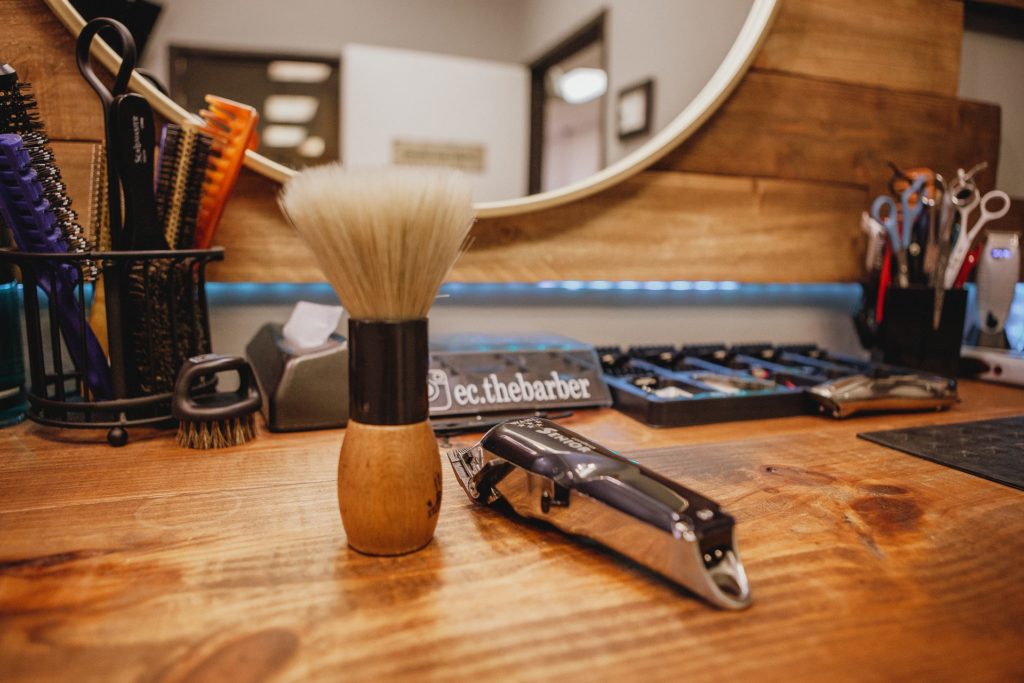 Beard grooming kit products on a wooden table