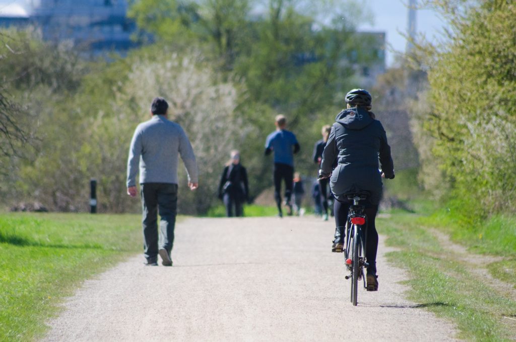 woman cycling in a park 