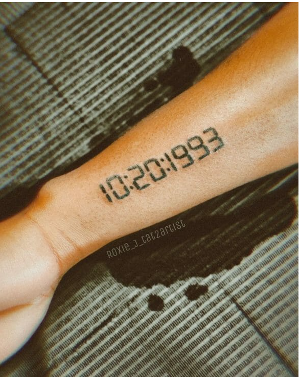 date tattoo on arm