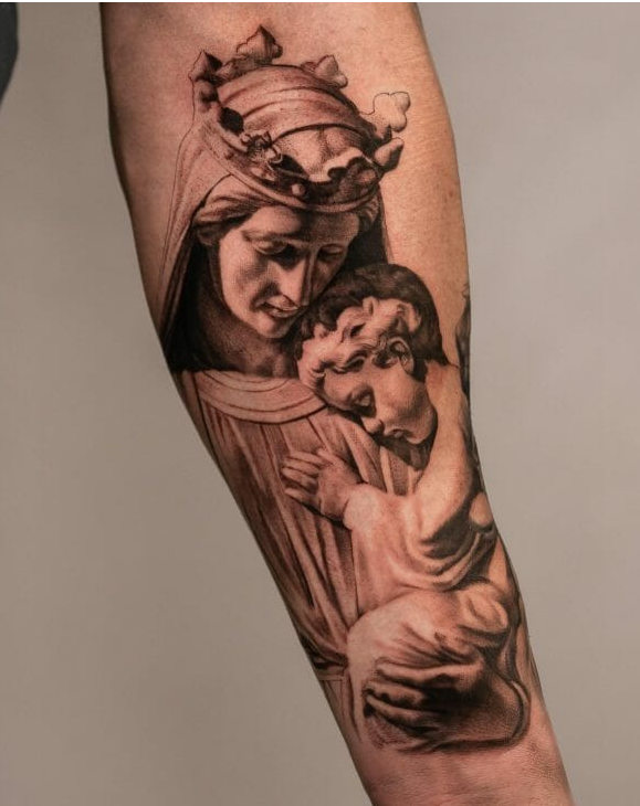 Virgin Mary Tattoo Holding Jesus Christ On Forearm
