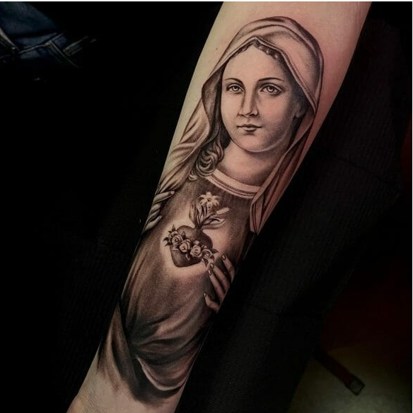 Virgin Mary forearm tattoo