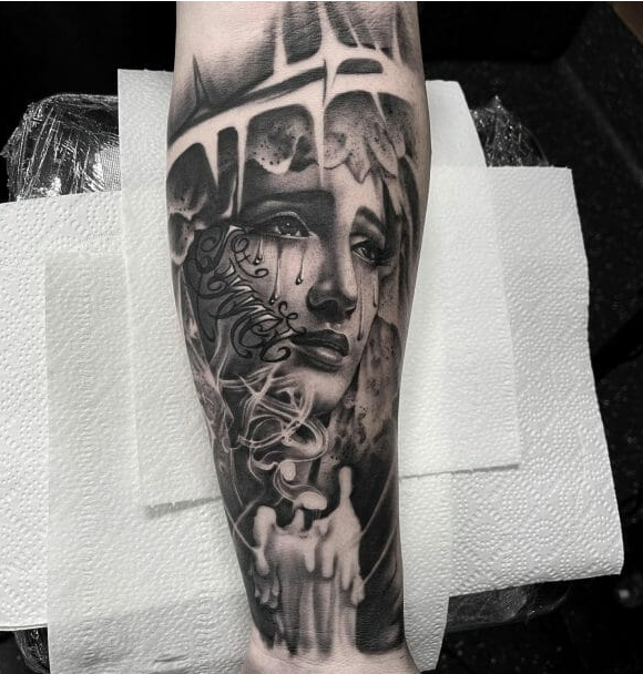 Virgin Mary forearm tattoo