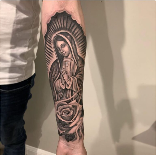 Black Virgin Mary tattoo forearm