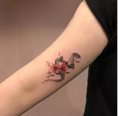 TINY SNAKE TATTOO WITH RED FLOWERS
