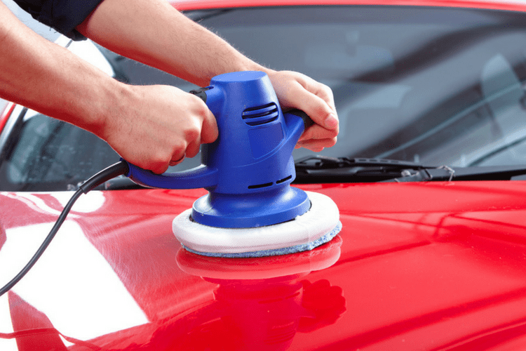 Buffing a car with power waxer