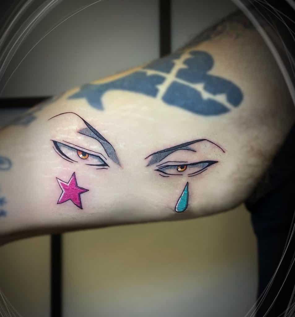 Minimalistic Hunter Tattoo with Eyes, Tear, and Star