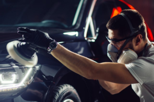 a man using a power waxer