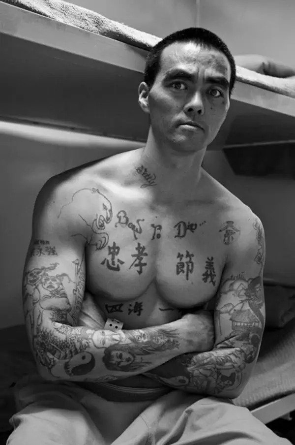 yin yang gang tattoo on arm
