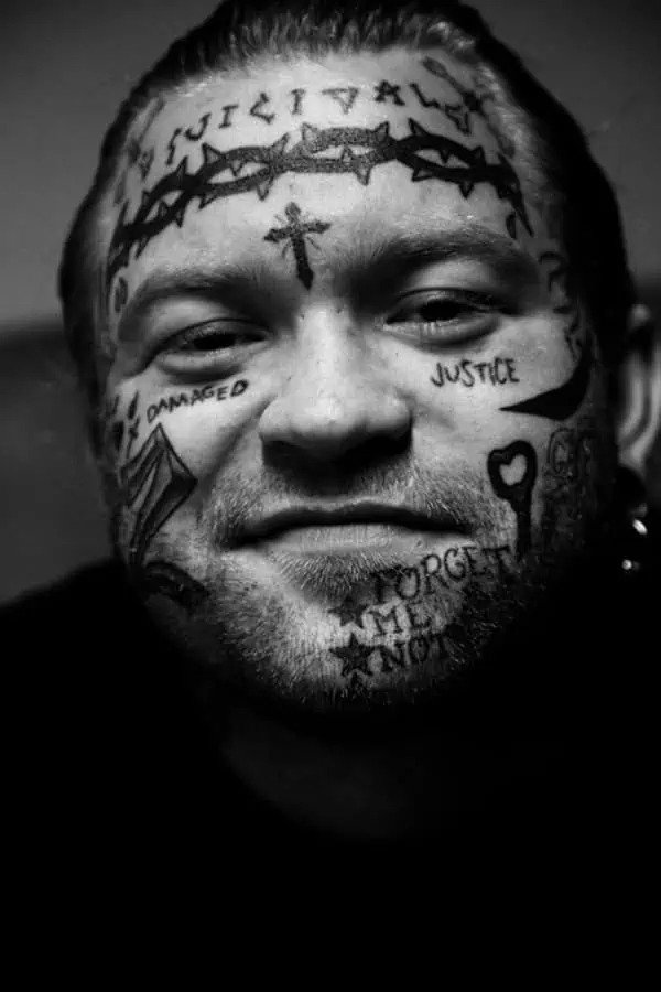 forehead cross gang tattoo