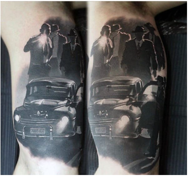 gangster mens lower leg tattoo with vintage car and city skyline design