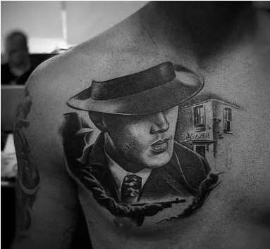 male with gangster upper chest portrait tattoo