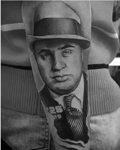 man with gangster sleeve mens tattoo