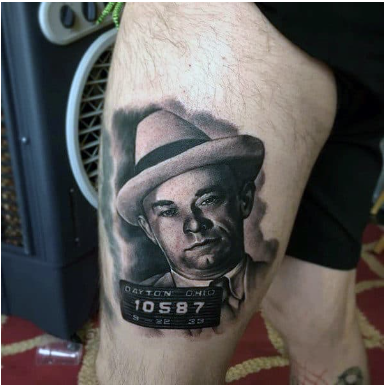thigh gangster portrait tattoo on man