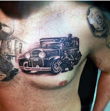 man with gangster tattoo on upper chest