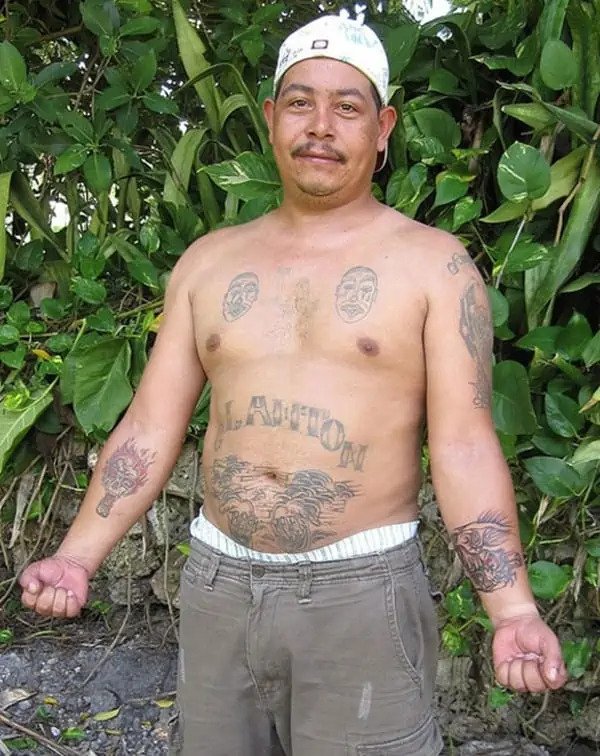 mask gang tattoo on chest