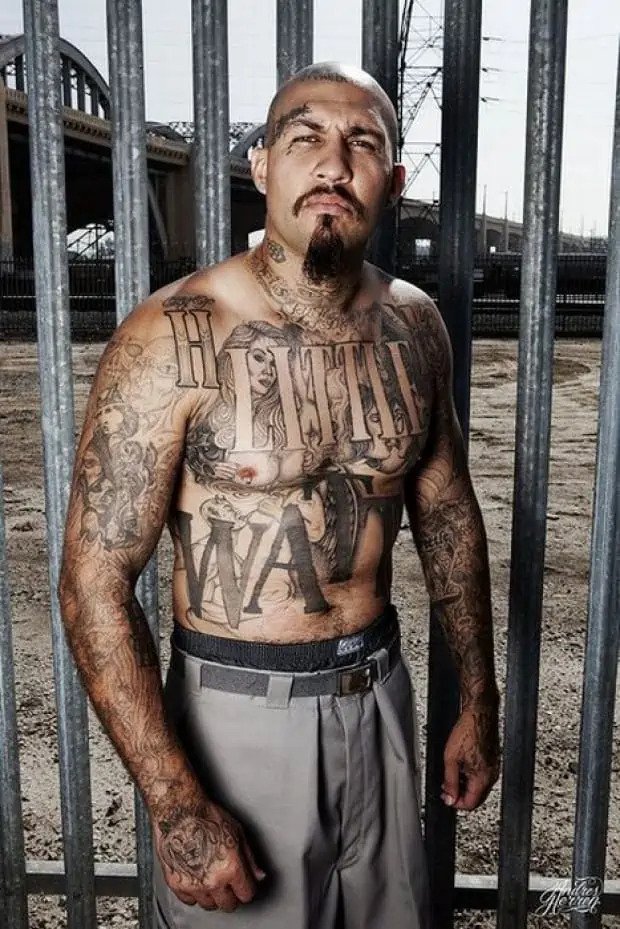 portrait gang tattoo on chest