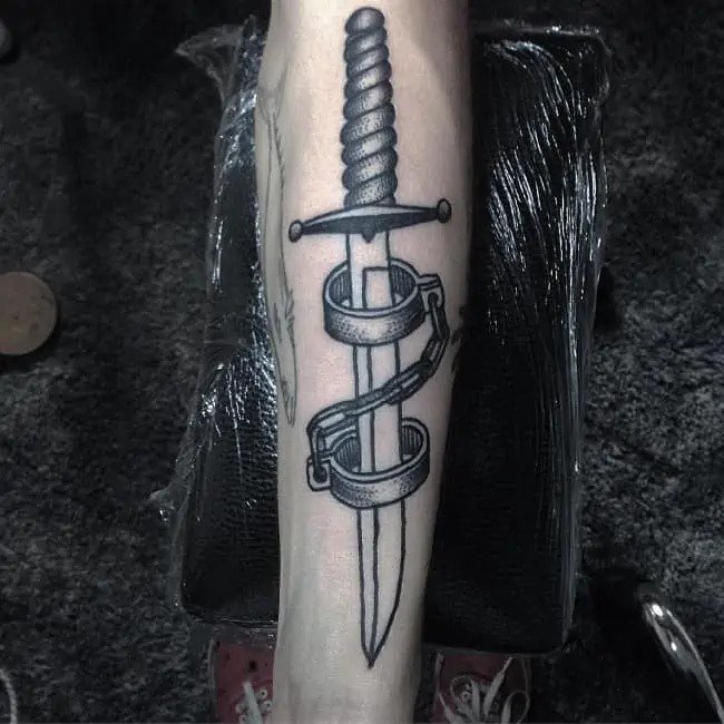 Dagger gang tattoo on arm