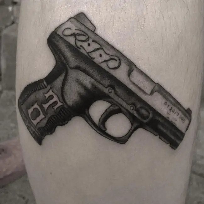 Gun gang leg tattoo
