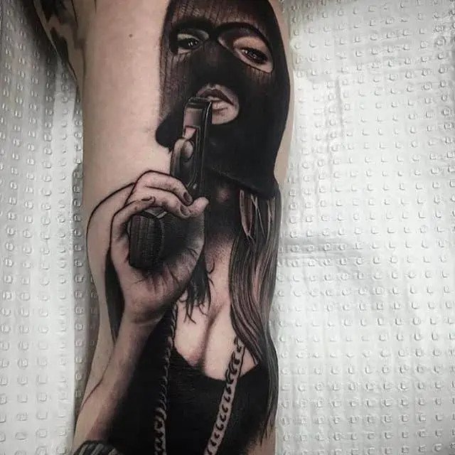 gun and mask gang tattoo