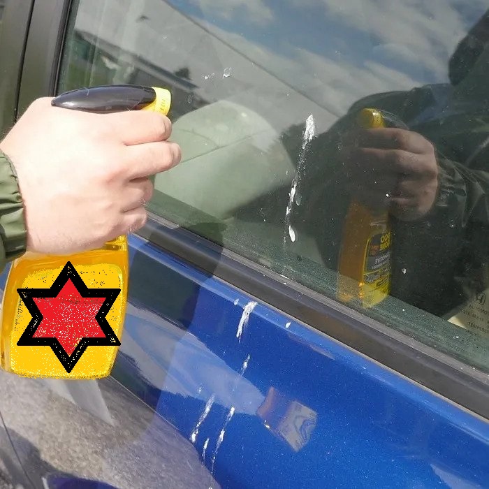 removing cleaning bird poop off a car with detailer spray