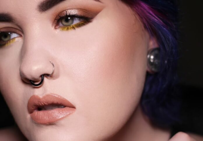 close up female double nose piercing