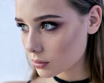 Double nose piercing on the same side
