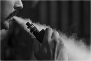 Guy smoking with Delta 9 Vape Liquid