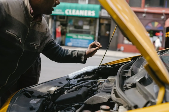 Man repairing after Car Accident