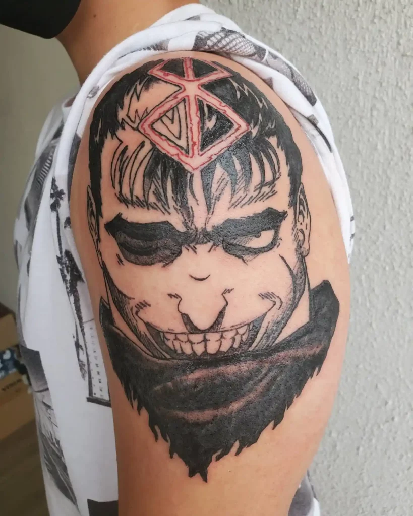 boy flaunting his Guts berserk tattoo on shoulder
