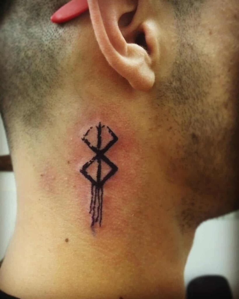 man flaunting his Berserk curse mark tattoo on neck