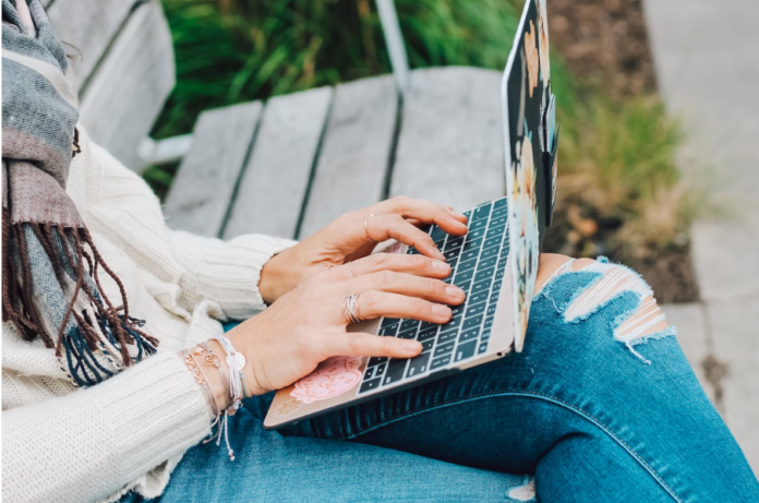 Girl typing on laptop