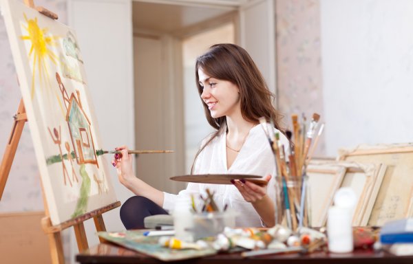 Women painting in a room and enjoying one of the artistic hobbies for women.