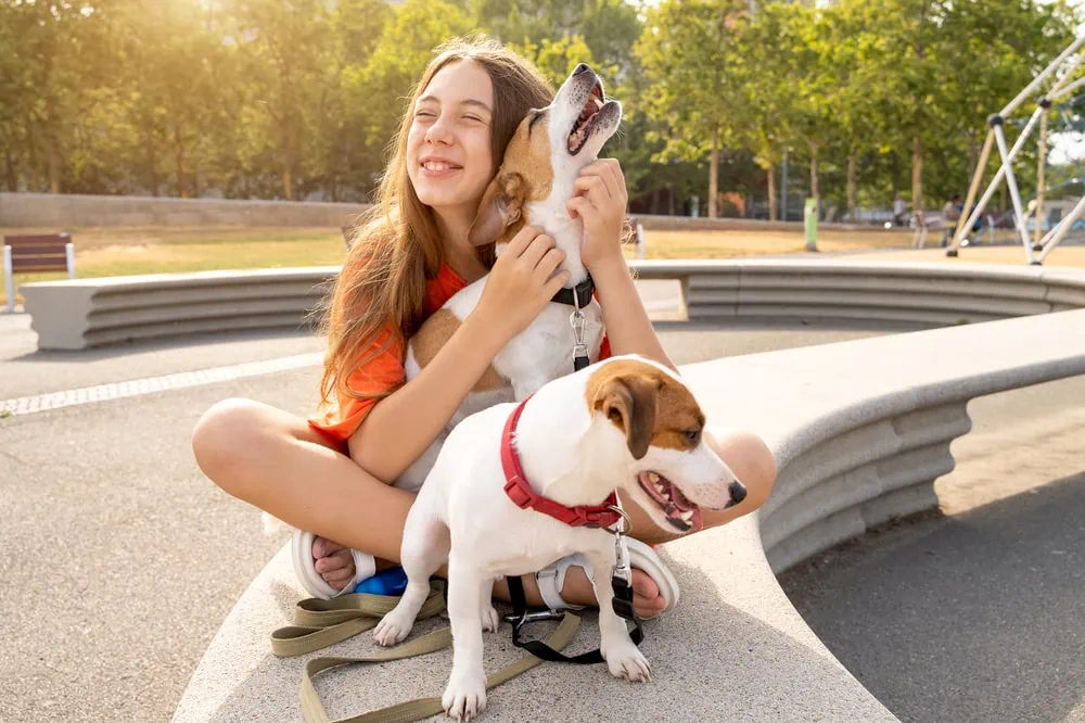 a girl having fun with the pets-one of the best jobs for 13 year olds